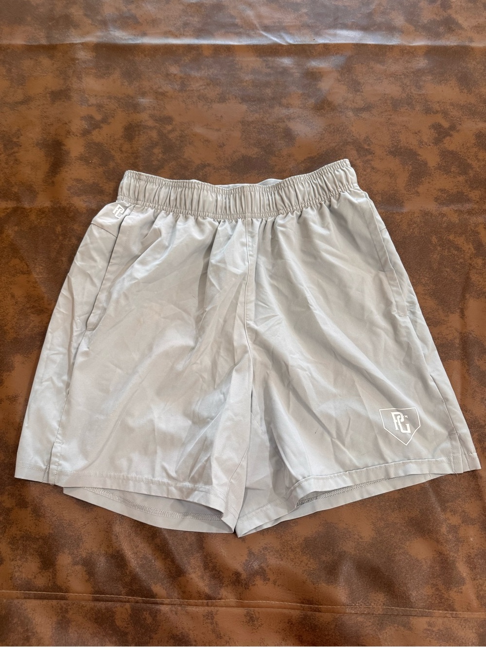 Men's Light Gray Athletic Shorts with Subtle Shield Logo